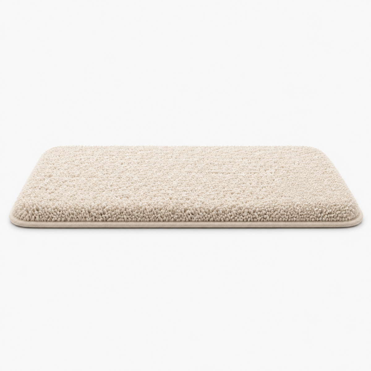 Tapis de bain épais et texturé avec base antidérapante sur un sol en carrelage