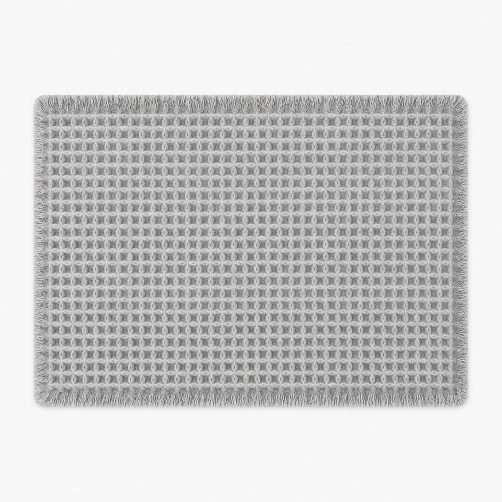 Tapis de bain gaufré à franges