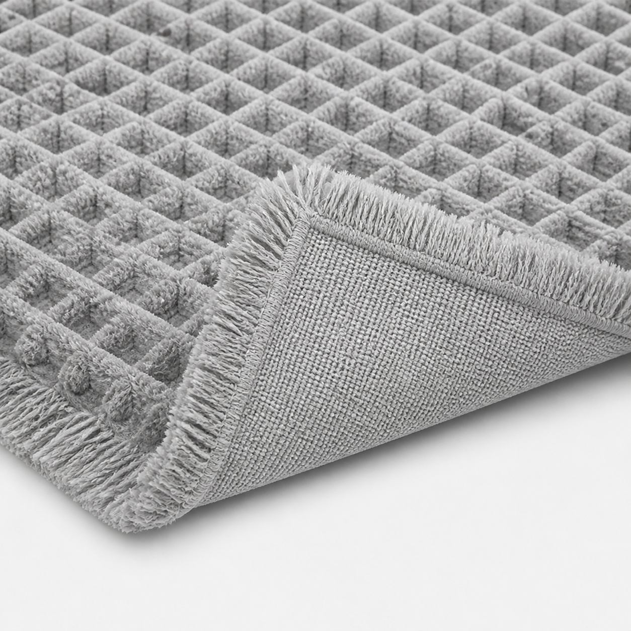 Tapis de bain gaufré à franges