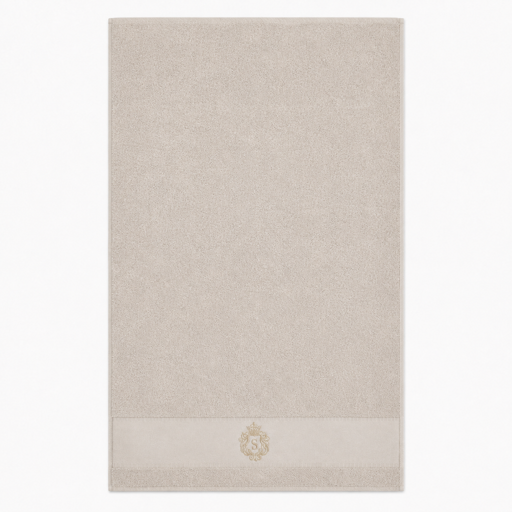 Serviette de bain beige à blason brodé