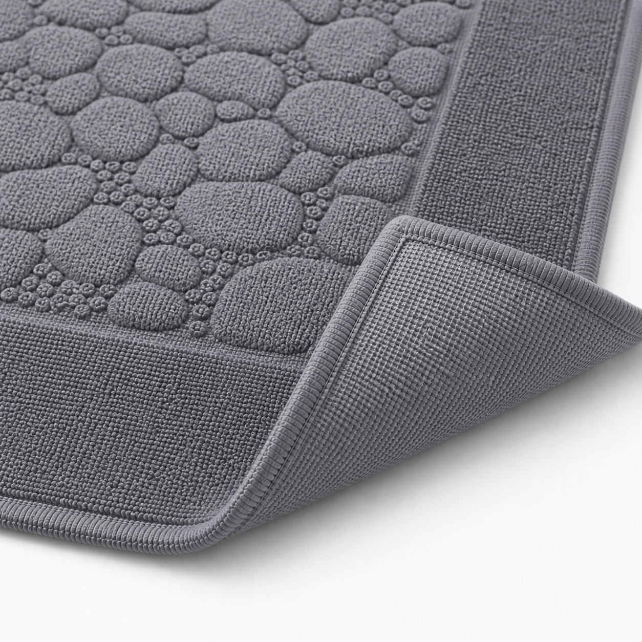 Tapis de bain à relief minéral