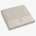 Serviette de bain beige à blason brodé